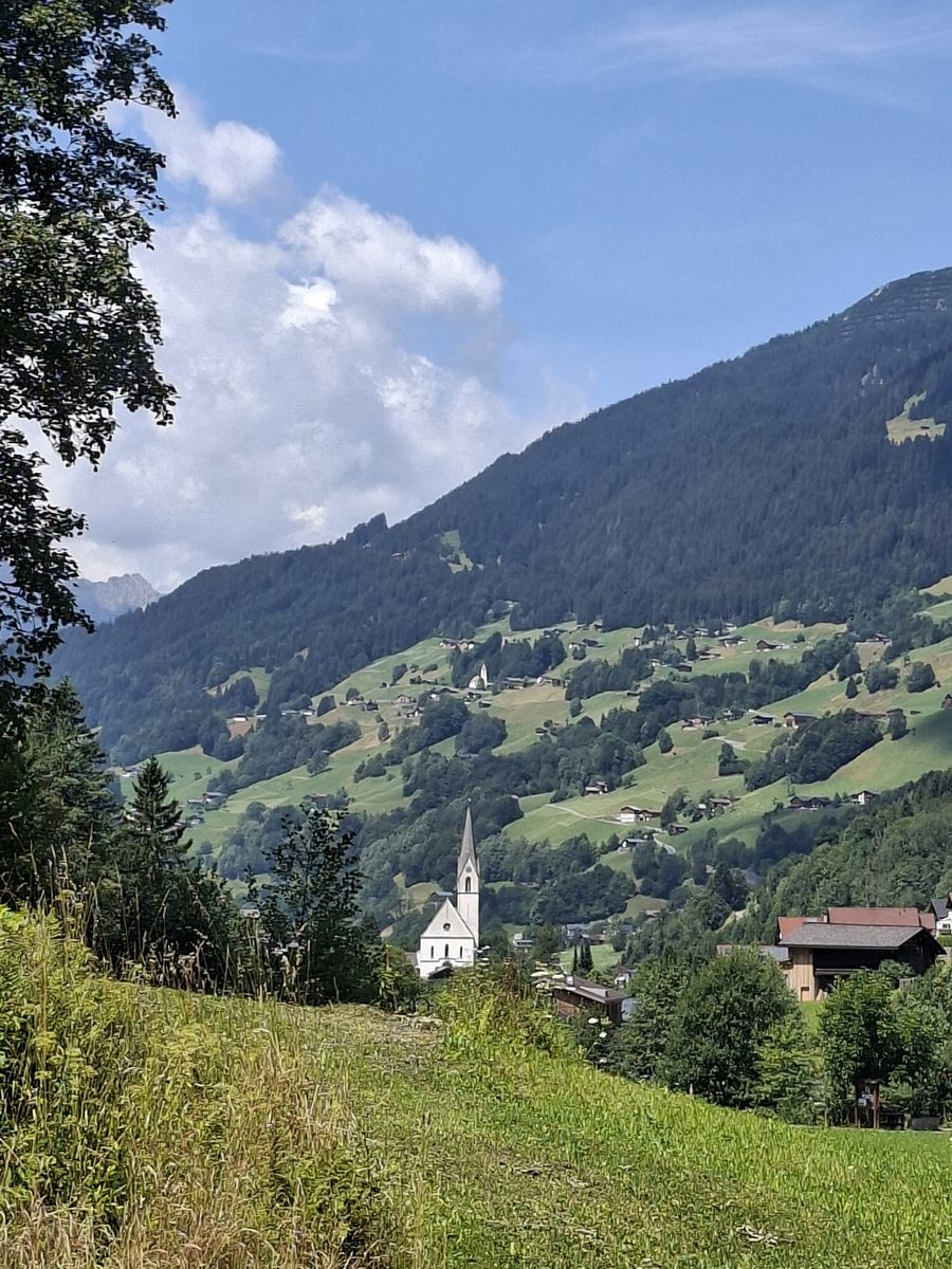 View over Silbertal and Saint Nikolaus Church toward Innerberg in Bartholomäberg, Vorarlberg